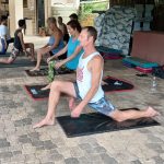 Pilates coach Leonard Lubbe stands with his right leg bent forward and the left leg stretched backwards during class in Sunwich Port