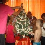 Children enjoy putting up Xmas decoration in SA