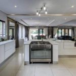 Openplan white kitchen and lounge