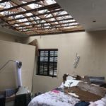 Bedroom with roof blown off