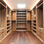 floor to ceiling shelving and wooden floor