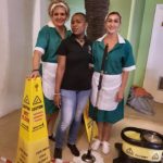 Three ladies in cleaning clothes with SHH cleaning equipment in their hands