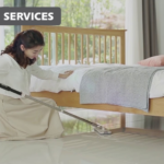 Lady cleaning under low bed with Vortex mop