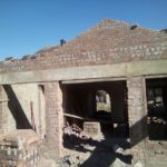 Building beams and lintels to create an entrance to a building under construction