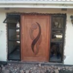 Door and window being installed after a hole was made in the wall by Nazareth in Durban