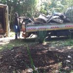 Open bed truck loaded with rubble