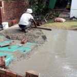 FixAll worker laying concrete slab