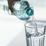 Bottle of mineral water from Agua e Vida being poured into a glass in Groenkloof Pretoria