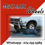 Poster with red and white background and a picture of a man working under a car to advertise mechanic on wheels