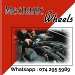 Poster with red and white background showing a picture of a car engine and hands working on it to advertise Mechanic on Wheels in Durban North