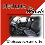 Poster with red and white background showing a picture of the seats of a car and steering wheel to advertise Mechanic on Wheels in Durban Northg wheel to advertise