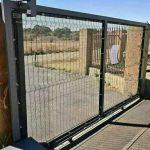 Large steel gate on rollers installed by Indlu Yegagu
