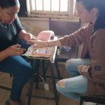 One lady giving the other lady a manicure at the ifafa Beach Hotel while sitting on chairs during the Family Fun Event on 28 Sept 2024