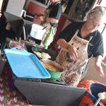 A row of vendors tables inside the Ifafa Beach hall included a vetkoek table which also sold sweet treats